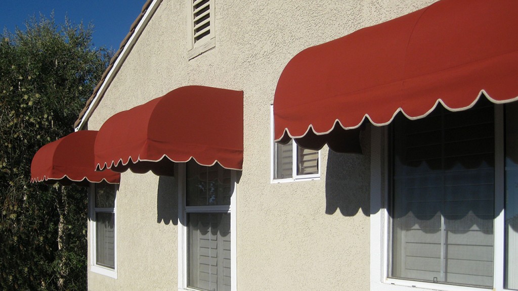 Red convex awnings over windows
